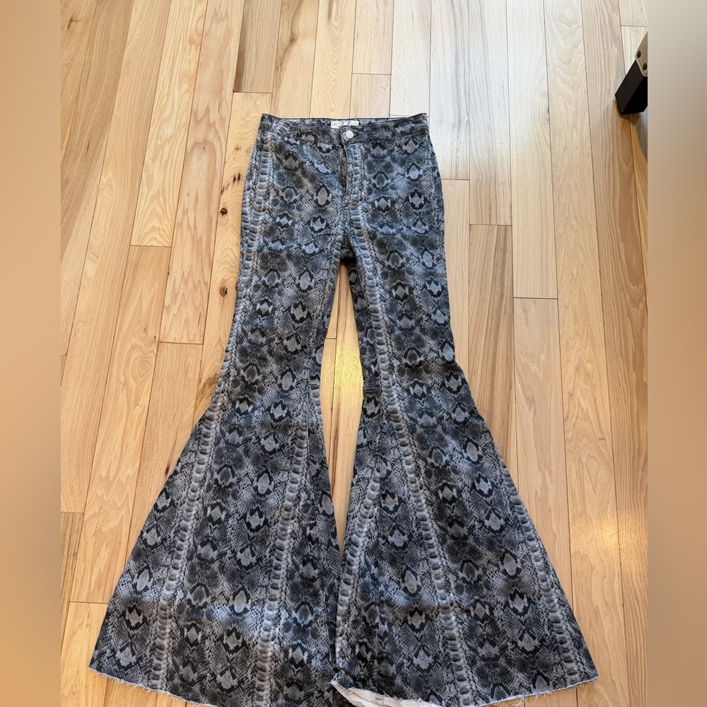 Free People We The Free Just Float On flare jeans in a gray snake print.